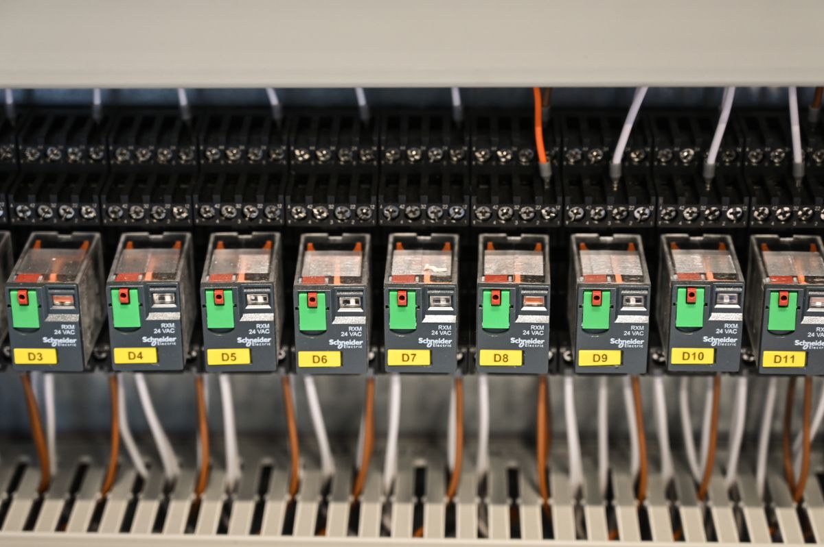 Rows of electrical relay components in an industrial panel